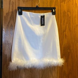 White boo hoo skirt with feather trim